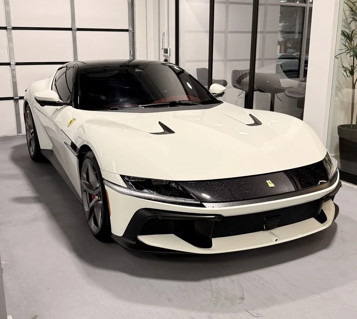 White sports car with dark ceramic window tint